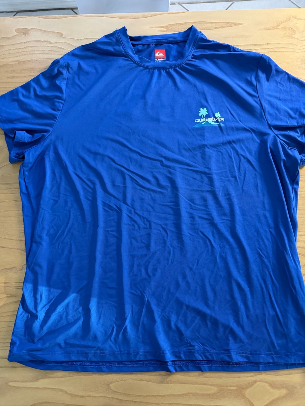 Quiksilver Dry-Fit Bright Blue Short-Sleeve Performance Tee with Palm Graphic